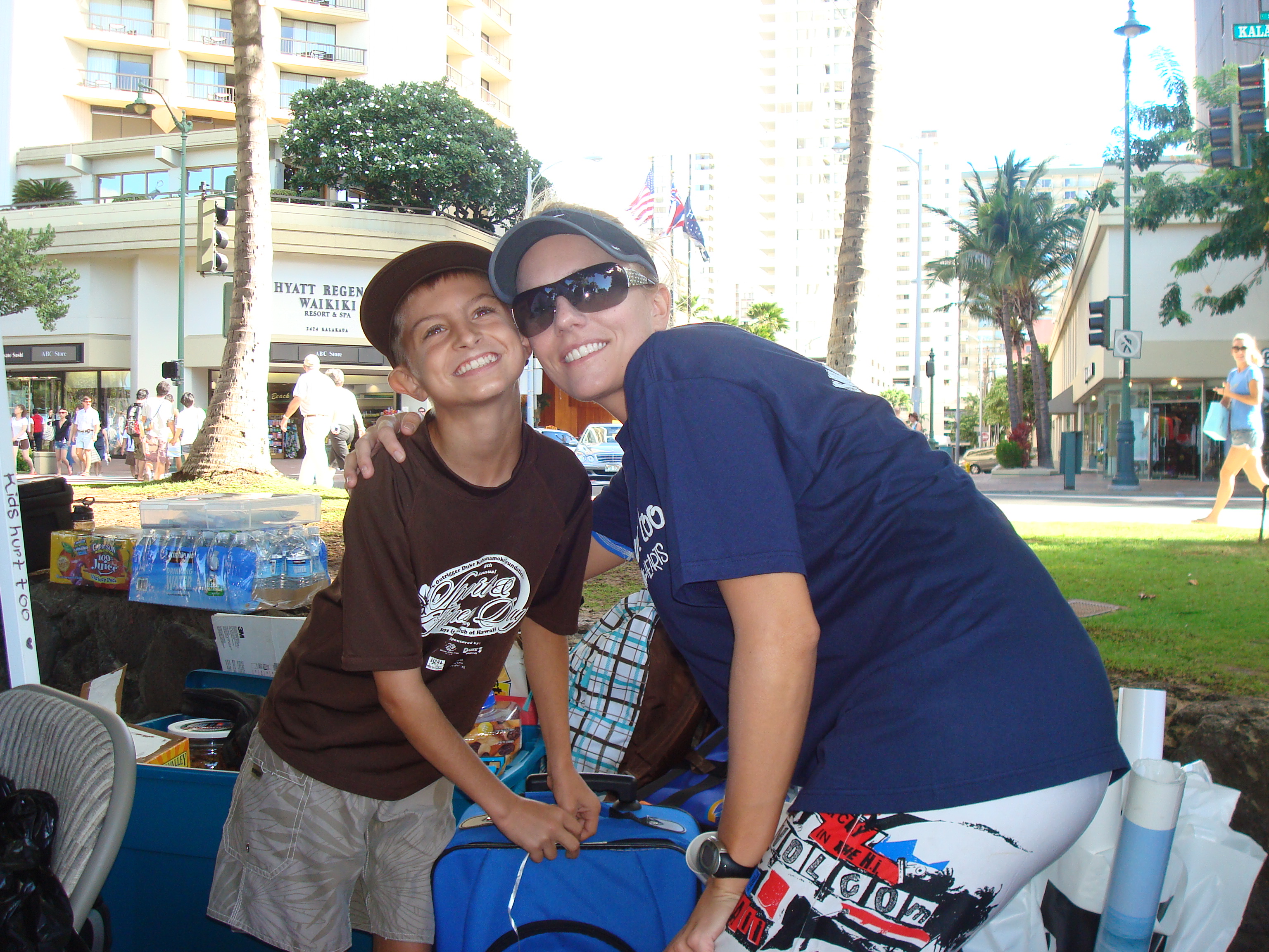 A smiling child and volunteer together at a community event