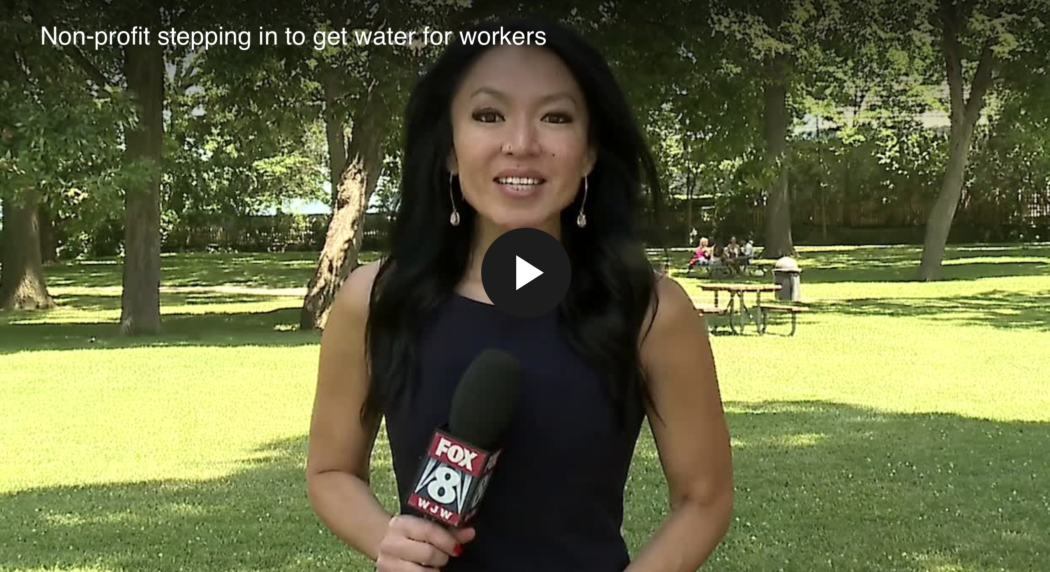 FOX 8 reporter covering the Tags4Lives water delivery for public works crews